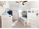 A ' bedroom featuring a modern, white bunk bed, a ceiling fan, and stylish décor at 222 Ellis Ln, Woodstock, GA 30189