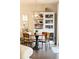 Elegant dining area with a modern table, seating, and open shelving at 222 Ellis Ln, Woodstock, GA 30189