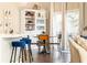 Bright dining area with a stylish table, chairs, and bar seating at 222 Ellis Ln, Woodstock, GA 30189