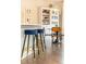 Stylish kitchen with modern bar stools and view of the dining area at 222 Ellis Ln, Woodstock, GA 30189