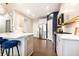 Beautiful open kitchen with modern appliances, white cabinets, and stylish island seating for entertaining at 222 Ellis Ln, Woodstock, GA 30189