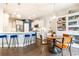 Modern kitchen with stainless steel appliances, white cabinetry, quartz countertops, and a breakfast bar at 222 Ellis Ln, Woodstock, GA 30189