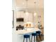Beautiful kitchen with modern lighting, stainless steel appliances, and breakfast bar at 222 Ellis Ln, Woodstock, GA 30189