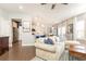 Spacious open floor plan featuring a large sectional sofa and seamless access to the kitchen at 222 Ellis Ln, Woodstock, GA 30189