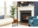 Charming living area with a cozy fireplace and bright natural light at 222 Ellis Ln, Woodstock, GA 30189