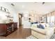 Bright and airy open-concept living space, perfect for entertaining, flowing into kitchen and dining at 222 Ellis Ln, Woodstock, GA 30189