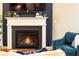 Cozy living room features a fireplace with a decorative mantle, ideal for relaxation and gatherings at 222 Ellis Ln, Woodstock, GA 30189