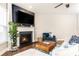 Inviting living room with fireplace, TV, comfortable seating, and stylish décor for relaxation at 222 Ellis Ln, Woodstock, GA 30189