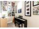 Well decorated music room with electric piano and framed music memorabilia at 222 Ellis Ln, Woodstock, GA 30189