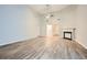 Spacious living room featuring wood-look floors and a cozy fireplace at 4394 Estate St, Atlanta, GA 30349