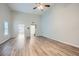 Bright living room with vaulted ceilings, ceiling fan, and hardwood floors at 4394 Estate St, Atlanta, GA 30349