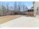 Spacious backyard with a patio and wooden fence, perfect for outdoor entertaining at 648 Ocean Ave, Canton, GA 30114