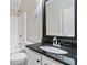 Bathroom featuring granite countertop vanity and shower-tub combination at 648 Ocean Ave, Canton, GA 30114