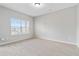Neutral bedroom with carpet and a large window, offering natural light at 648 Ocean Ave, Canton, GA 30114