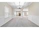 Dining room with coffered ceiling, chandelier, and arched entryways at 648 Ocean Ave, Canton, GA 30114