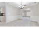 Open dining room with chandelier, wainscoting, and arched doorways at 648 Ocean Ave, Canton, GA 30114