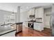 Updated kitchen with stainless steel appliances, granite countertops and hardwood floors at 648 Ocean Ave, Canton, GA 30114