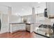 Well-designed kitchen features stainless steel appliances, granite countertops, and hardwood floors at 648 Ocean Ave, Canton, GA 30114