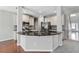 Open concept kitchen with granite countertops, stainless steel appliances, and ample cabinet space at 648 Ocean Ave, Canton, GA 30114