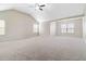 Large primary bedroom boasts vaulted ceiling and multiple windows for ample natural light at 648 Ocean Ave, Canton, GA 30114