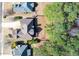 Aerial view of neighborhood homes with a wooded backyard and manicured lawns at 76 Misty View Ln, Acworth, GA 30101