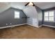 Finished attic space with carpet, window, and slanted ceiling at 76 Misty View Ln, Acworth, GA 30101