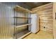 Basement pantry area has refrigerator and shelving at 76 Misty View Ln, Acworth, GA 30101