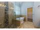 Elegant bathroom featuring a glass-enclosed shower, freestanding tub, and walk-in closet at 76 Misty View Ln, Acworth, GA 30101