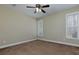 Bedroom with neutral walls and carpet, featuring a window and baseboard trim at 76 Misty View Ln, Acworth, GA 30101