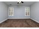 Bedroom with neutral walls, carpet, and plantation shutters on the windows at 76 Misty View Ln, Acworth, GA 30101