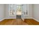 Bright and airy bedroom with natural light, hardwood floors, and an access door to the outdoor living space at 76 Misty View Ln, Acworth, GA 30101