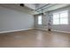 Spacious two car garage with painted floor, shelving, and windows at 76 Misty View Ln, Acworth, GA 30101