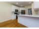 Updated kitchen featuring white cabinets, stainless steel appliances, black hardware, and marble countertops and backsplash at 76 Misty View Ln, Acworth, GA 30101