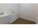 Practical laundry room with a utility sink and storage shelves at 76 Misty View Ln, Acworth, GA 30101