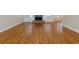 Spacious living room boasts hardwood flooring and a brick fireplace at 76 Misty View Ln, Acworth, GA 30101