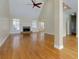 Spacious living room boasts hardwood flooring, a fireplace, and abundant natural light from large windows at 76 Misty View Ln, Acworth, GA 30101