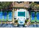 Aerial view of tennis courts and a covered pool with a clubhouse, landscaped grounds and an adjacent parking at 76 Misty View Ln, Acworth, GA 30101