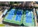 Aerial view of community tennis courts, fenced and well maintained at 76 Misty View Ln, Acworth, GA 30101
