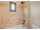 Bright bathroom featuring colorful stained glass window and decorative tile at 130 Woodlawn Ne Dr, Marietta, GA 30067