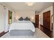 Inviting bedroom with large bed and view of the outdoors at 130 Woodlawn Ne Dr, Marietta, GA 30067