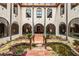 Courtyard with a water feature and arched windows at 130 Woodlawn Ne Dr, Marietta, GA 30067