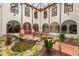Tranquil courtyard features a pond, lush landscaping, and abundant light from the surrounding windows at 130 Woodlawn Ne Dr, Marietta, GA 30067