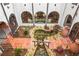 Charming courtyard with tiled floor, indoor garden, water feature, and arched windows at 130 Woodlawn Ne Dr, Marietta, GA 30067