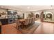 Dining room next to kitchen with view of the courtyard, large wood table and decorative rug at 130 Woodlawn Ne Dr, Marietta, GA 30067