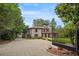 Elegant home with a gated driveway and beautiful landscaping at 130 Woodlawn Ne Dr, Marietta, GA 30067