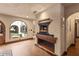 Hallway featuring a fireplace with rustic blue and red brick design at 130 Woodlawn Ne Dr, Marietta, GA 30067