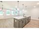 Open-concept kitchen featuring a large center island and modern pendant lighting at 171 Bluffington Way, Marietta, GA 30066