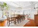 Spacious dining room boasts coffered ceilings, a stylish chandelier, and views of the outdoors at 205 Mead Rd, Decatur, GA 30030