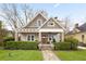 Charming craftsman home featuring stone accents, a covered porch, and beautifully landscaped front yard at 205 Mead Rd, Decatur, GA 30030