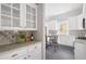 Bright kitchen featuring white cabinets, granite countertops, and stainless steel appliances at 205 Mead Rd, Decatur, GA 30030